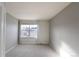 Simple bedroom with neutral decor and window at 9362 Autumn Ash Ct, Highlands Ranch, CO 80126