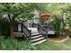 Spacious deck with seating area and umbrella at 9362 Autumn Ash Ct, Highlands Ranch, CO 80126