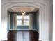 Elegant dining room with hardwood floors and blue accent wall at 9362 Autumn Ash Ct, Highlands Ranch, CO 80126