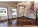 Bright entryway with hardwood floors and staircase at 9362 Autumn Ash Ct, Highlands Ranch, CO 80126