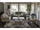 Living room with hardwood floors, neutral decor, and ample natural light at 9362 Autumn Ash Ct, Highlands Ranch, CO 80126