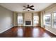 Spacious living room featuring hardwood floors and a fireplace at 9362 Autumn Ash Ct, Highlands Ranch, CO 80126