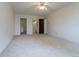 Spacious bedroom with carpet, ceiling fan, and access to bathroom and closet at 3144 S Wheeling Way # 209, Aurora, CO 80014