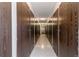 Hallway with multiple storage units, featuring dark brown doors at 3144 S Wheeling Way # 209, Aurora, CO 80014