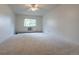 Bright bedroom with carpet, window, and ceiling fan at 3144 S Wheeling Way # 209, Aurora, CO 80014