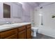 Bathroom with tub, shower, vanity, and wood cabinets at 3144 S Wheeling Way # 209, Aurora, CO 80014