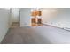 Spacious living room with carpeted floor and view of kitchen at 3144 S Wheeling Way # 209, Aurora, CO 80014