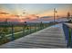 Boardwalk path with scenic sunset views and mountain backdrop at 21295 E 61St Dr, Aurora, CO 80019