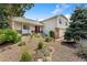 Two-story home with mature landscaping and a charming front entrance at 3612 S Waco Way, Aurora, CO 80013