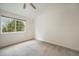 Bright bedroom featuring a large window and neutral carpeting at 12242 Bannock Circle # B, Denver, CO 80234