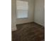 Simple bedroom with neutral carpet and window coverings at 1964 Galena St, Aurora, CO 80010