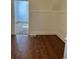 Simple dining area with wood-look floors and access to other rooms at 1964 Galena St, Aurora, CO 80010