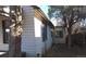White sided home with mature trees and a partially visible deck at 1964 Galena St, Aurora, CO 80010