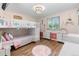 bedroom with bunk bed, dresser, and cheerful decor at 983 S Joplin Way, Aurora, CO 80017