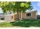 Ranch style home with a large front yard and mature tree at 983 S Joplin Way, Aurora, CO 80017