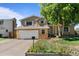 Two-story house with attached garage and landscaped yard at 983 S Joplin Way, Aurora, CO 80017