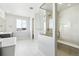 Modern bathroom with a walk-in shower and double vanity at 5672 Red Pebble Pt, Castle Rock, CO 80104