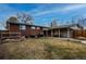 Brick home with covered patio and fenced backyard at 1418 Sunset St, Longmont, CO 80501