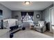 Charming Bedroom with gray walls and a comfortable armchair at 1418 Sunset St, Longmont, CO 80501