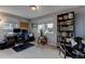 Home office with built-in shelving and hardwood floors at 1418 Sunset St, Longmont, CO 80501