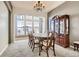 Formal dining room with a large table, chandelier, and built-in hutch at 13505 W 86Th Dr, Arvada, CO 80005