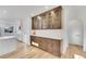 Modern kitchen with white cabinets and quartz countertops at 975 S Fillmore Way, Denver, CO 80209