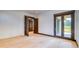 Light-filled bedroom with french doors leading to balcony at 11790 Huckleberry Dr, Franktown, CO 80116