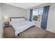 Spacious bedroom with a king-size bed and ample natural light at 18971 E Mercer Dr, Aurora, CO 80013