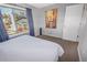 Bedroom with a queen-size bed, large window, and view at 18971 E Mercer Dr, Aurora, CO 80013