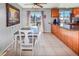 Bright dining area with a table and chairs next to the kitchen at 18971 E Mercer Dr, Aurora, CO 80013