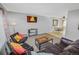 Spacious living room with leather furniture and dining area view at 18971 E Mercer Dr, Aurora, CO 80013