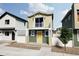 Two-story craftsman style home with balcony and yellow door at 13026 E 103Rd Ave, Commerce City, CO 80022