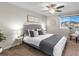 Comfortable secondary bedroom with ceiling fan and window seat at 11555 W 70Th Pl # E, Arvada, CO 80004