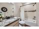 Clean bathroom with granite countertop, tub, and decorative tile at 4056 Happy Hollow Dr, Castle Rock, CO 80104