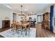 Bright dining room with hardwood floors and elegant chandelier at 4056 Happy Hollow Dr, Castle Rock, CO 80104