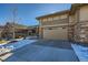 Home's exterior featuring a two-car garage and snowy landscaping at 4056 Happy Hollow Dr, Castle Rock, CO 80104