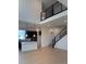 Two-story living room with hardwood floors and modern staircase at 14245 Currant St, Broomfield, CO 80020