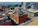 Building's rooftop deck and balcony shown in an aerial view with city backdrop at 1792 Wynkoop St # 502, Denver, CO 80202