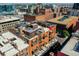 Aerial view highlighting a building's rooftop deck and surrounding city at 1792 Wynkoop St # 502, Denver, CO 80202