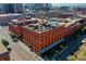 Aerial view of a brick building with rooftop deck and city views at 1792 Wynkoop St # 502, Denver, CO 80202