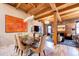 Dining area with modern table, chairs, and exposed beams at 1792 Wynkoop St # 502, Denver, CO 80202