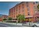 Building's exterior with street-level patio and urban backdrop at 1792 Wynkoop St # 502, Denver, CO 80202