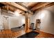 Private home gym with wood flooring, rowing machine, and free weights at 1792 Wynkoop St # 502, Denver, CO 80202