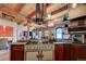 Upscale kitchen featuring exposed brick, wood beams, and high-end appliances at 1792 Wynkoop St # 502, Denver, CO 80202