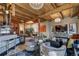 View of the living room, kitchen and dining area with exposed beams and hardwood floors at 1792 Wynkoop St # 502, Denver, CO 80202