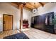 Living room with hardwood floors, exposed beams, and built-in storage at 1792 Wynkoop St # 502, Denver, CO 80202