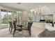 Modern dining room with glass table and access to deck at 7 Elk Pointe Ln, Castle Rock, CO 80108