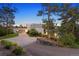 Contemporary home with a long driveway and landscaping at 7 Elk Pointe Ln, Castle Rock, CO 80108