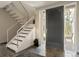 Elegant entryway with a modern staircase and a sleek front door at 7 Elk Pointe Ln, Castle Rock, CO 80108