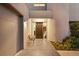 Modern home entry with a contemporary door and small seating area at 7 Elk Pointe Ln, Castle Rock, CO 80108